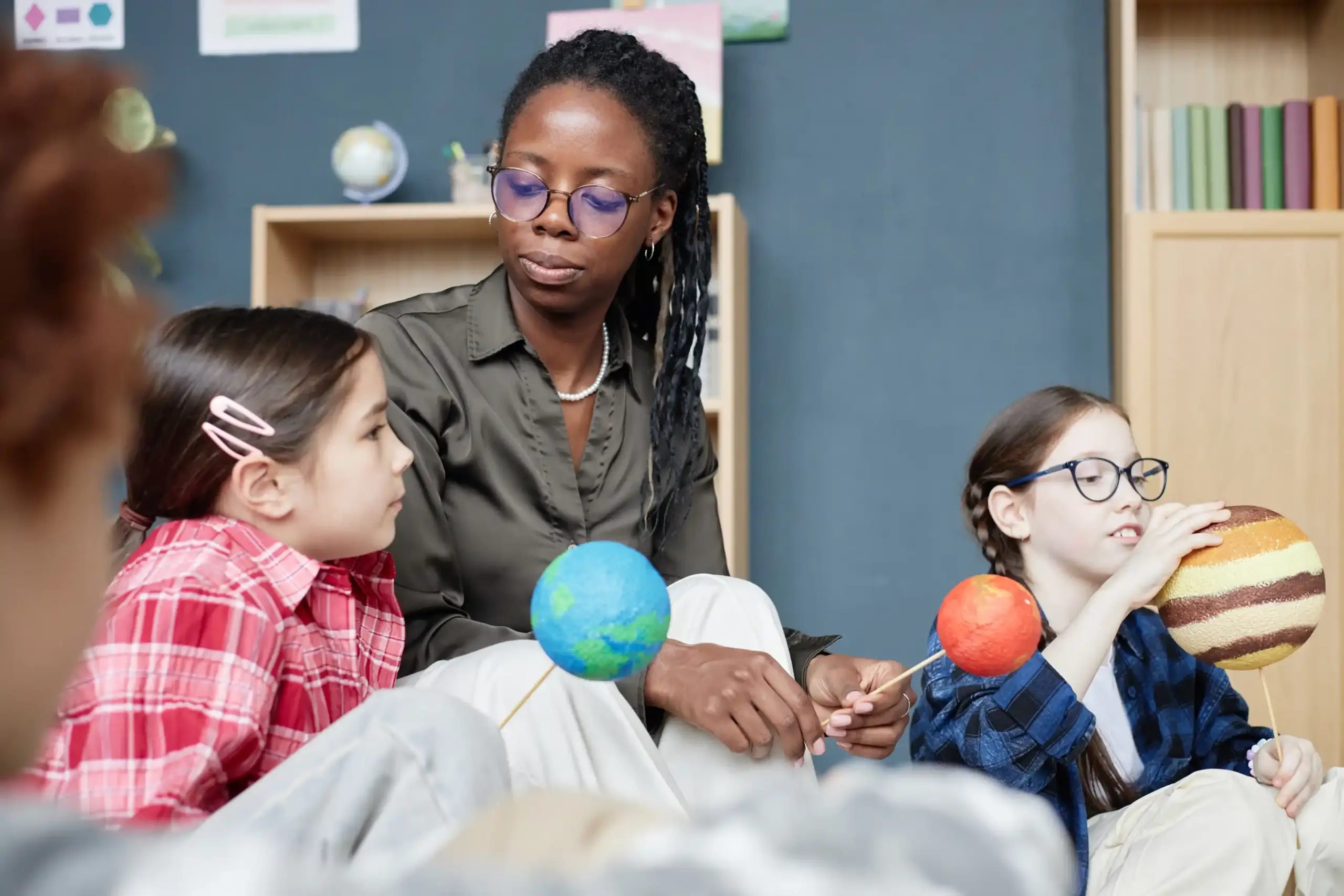 Metanoia Academy - Autism School Bloemfontein - black-young-adult-woman-teaching-diverse-children